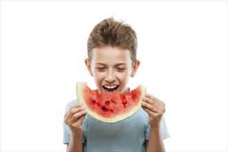 Handsome smiling child boy hand holding red ripe watermelon fruit food slice white isolated