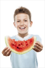 Handsome smiling child boy hand holding red ripe watermelon fruit food slice white isolated