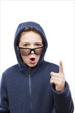 Amazed or surprised teenager boy wearing glasses gesturing exclamation point finger sign white