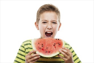 Handsome smiling child boy hand holding red ripe watermelon fruit food slice white isolated