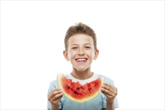 Handsome smiling child boy hand holding red ripe watermelon fruit food slice white isolated