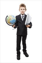 Handsome smiling child boy in business suit hand holding planet Earth globe and education reading