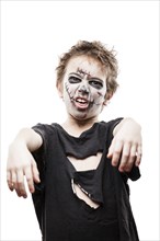 Halloween or horror concept, screaming walking dead zombie child boy reaching hand white isolated