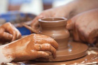 Pottery craft wheel ceramic clay potter human hand