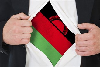 The Malawi flag painted on the chest of a man