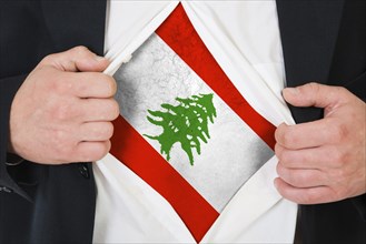 The Lebanese flag painted on the chest of a man