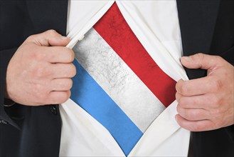 The Luxembourg flag painted on the chest of a man