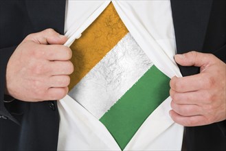 The Republic of Ivory Coast flag painted on the chest of a man