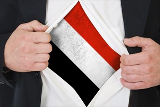 The Yemeni flag painted on the chest of a man