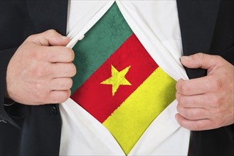 The Cameroonian flag painted on the chest of a man