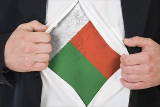 The Madagascar flag painted on the chest of a man