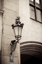 Retro style image of street lamp with doves on a wall