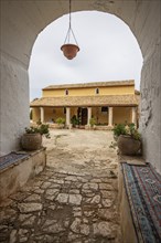 Beautiful typical Greek monastery walls. Ruins in the Mediterranean architectural style of Greece.