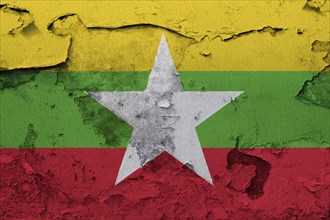 Myanmar flag painted on the cracked grunge concrete wall