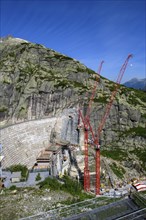 View of construction site of new dam for enlargement of reservoir Grimselsee replacement dam