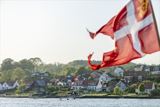 Svendborg, maritime living by the sound, detached houses, forest, Danish flags, backlight, Fyn,