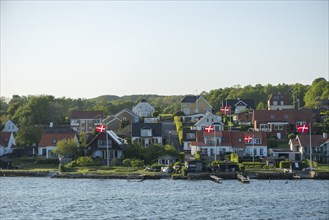 Svendborg, maritime living by the sound, detached houses, forest, Danish flags Fyn, island of