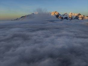 Aerial view, steep mountains, coast, winter, fog, morning light, Reine, Moskenesoya, Lofoten,