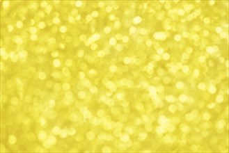 Golden bokeh background for christmas, defocused round lights and sunbeams, flare overlay