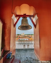 Bell tower of the La Merced church with a view of the cathedral in Granada, Nicaragua, Central