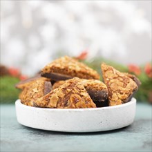 Nut corner triangles, traditional german sweets called Nussecke, covered with chocolate, christmas