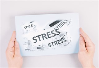 The word stress is standing on a paper, pen with eraser, burnout concept, work life balance,