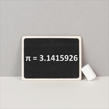 The mathematical constant pi 3, 141 is standing on a chalkboard, defined in Euclidean geometry as