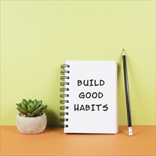 The words build good habits are standing on a notebook, change lifestyle, healthy and positive