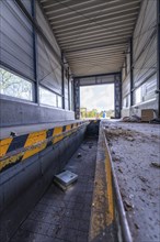 Abandoned hall or workshop with metal structures and side light, demolition site, Saarbrücken,