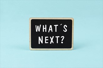 The phrase whatÂ´s next is standing on a chalkboard, having new goals and strategies, making plans