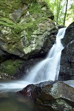 Waterfall and rocks in the Trübenbachtal nature reserve near Kirn in Naheland on the edge of the