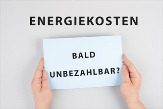 Energy prices soon unaffordable is standing in german language on the paper, increasing prices,