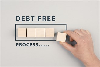 The words debt free in process are standing next to the loading bar, ending credit payments and