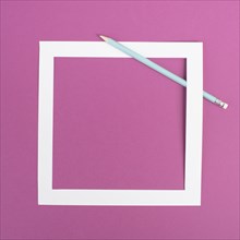 Pencils on a pink paper background, white frame with copy space for text, minimalism, creative and