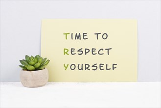 The words time to respect yourself are standing on paper, responsibility and development,