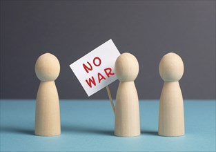 Group of protesters holding a sign with the words no war, demonstration for human right and