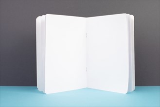 Open white book page, school and education concept, copy space for text, blank paper, gray and blue