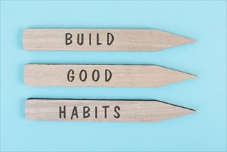 The words build good habits are standing on arrows, change lifestyle, healthy and positive