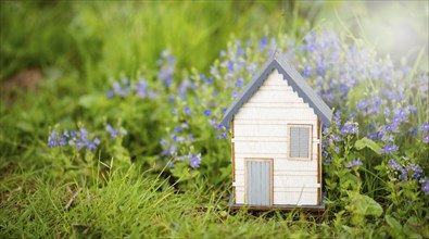 Wooden house in a meadow, buying or renting a house in nature, real estate concept, booking home