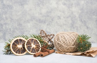 Christmas items like dried oranges, hazelnuts, fir branch, empty copy space