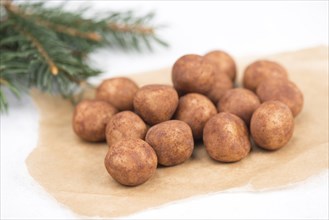 Marzipan potatoes, in german called Marzipankartoffeln, with cacao powder, sweets for christmas,