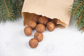 Marzipan potatoes, in german called Marzipankartoffeln, with cacao powder, sweets for christmas,