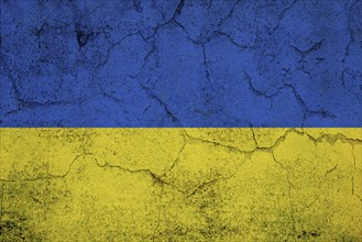 Ukrainain flag on a textured wall, national idendity, war crisis between Ukraine and Russia,