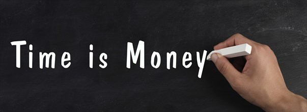 Time is money is standing on a chalkboard, finance knowledge and strategy, working for salery,