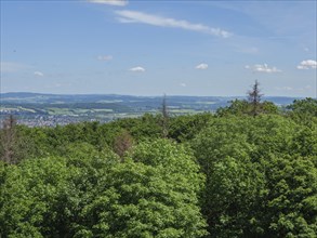 View of wooded hills and clear sky with few clouds, Detmold, North Rhine-Westphalia, Germany,