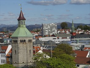 Cityscape with historic and modern buildings, a tower and Bergen in the background, Stavanger,