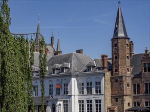 Historic city centre with characteristic architectural towers and brick buildings under a clear