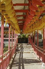 A corridor with red structures and hanging lanterns, arranged in steps, Pattaya, Thailand, Asia