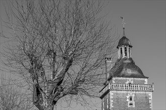 Close-up of a castle tower and a bare tree in black and white, clear and sharp lines, raesfeld,