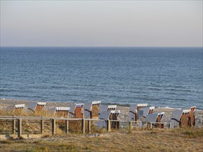 Panorama of a beach with rows of beach chairs and sweeping sea views, Binz, Rügen, Germany, Europe